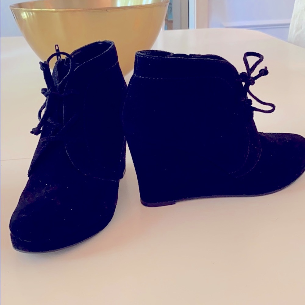 Black suede wedge shoes.